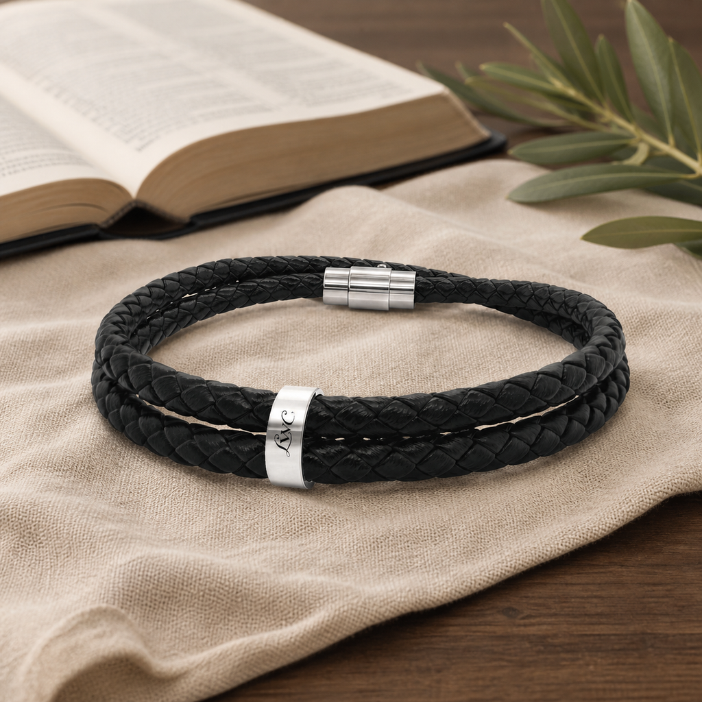 LWC Leather Bead Bracelet shown on linen beside an open Bible and olive branch.